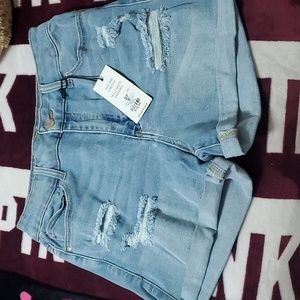 NWT High rise stretch denim shorts. Size 7. Light wash blue.